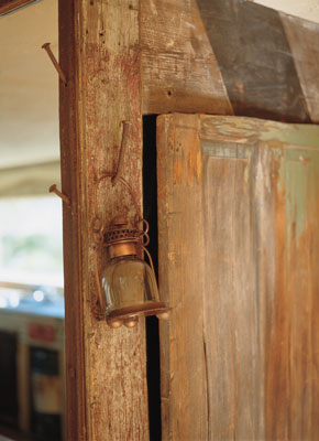 John seals flaking wood using water-based polyurethane and a touch of oil-based stain. The nails used for hanging objects were found on the property.
